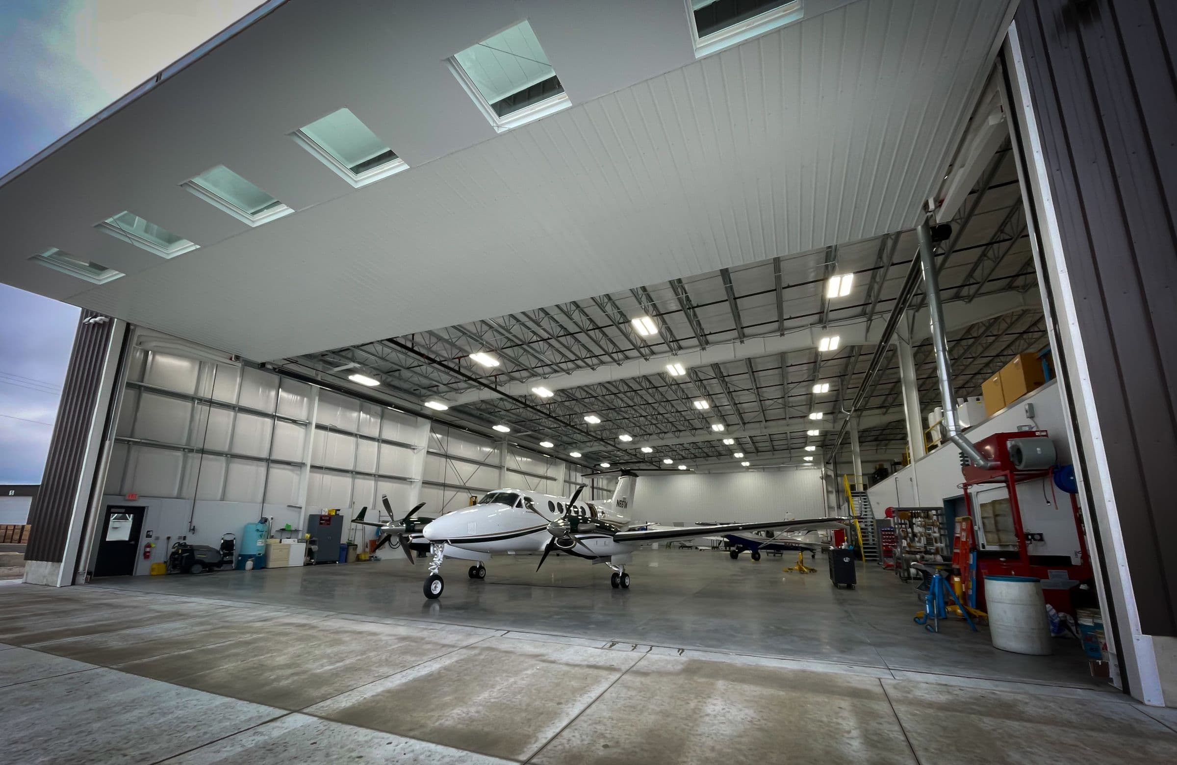 Light aircraft inside a spacious aviation hangar